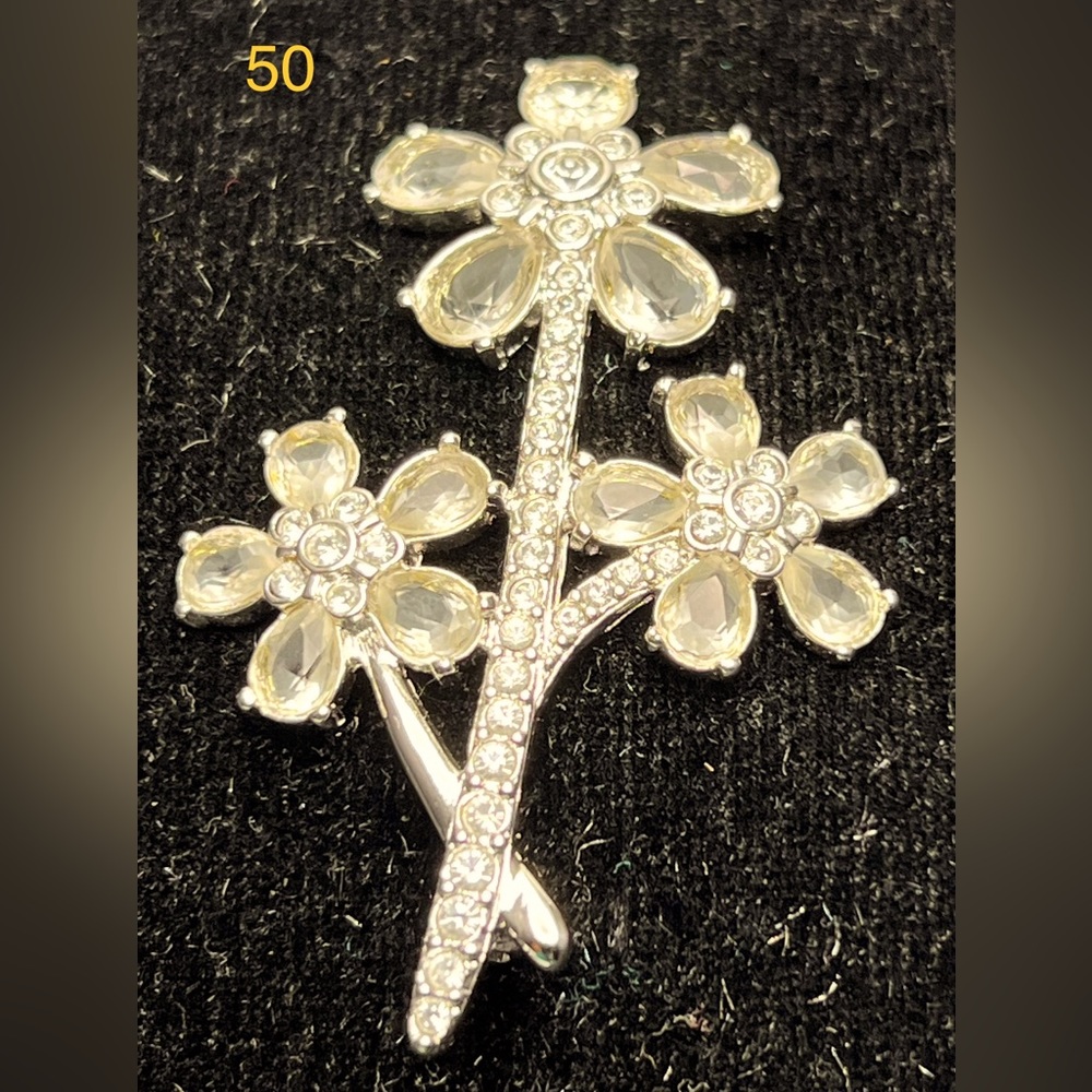 Swarovski crystal flower brooch.